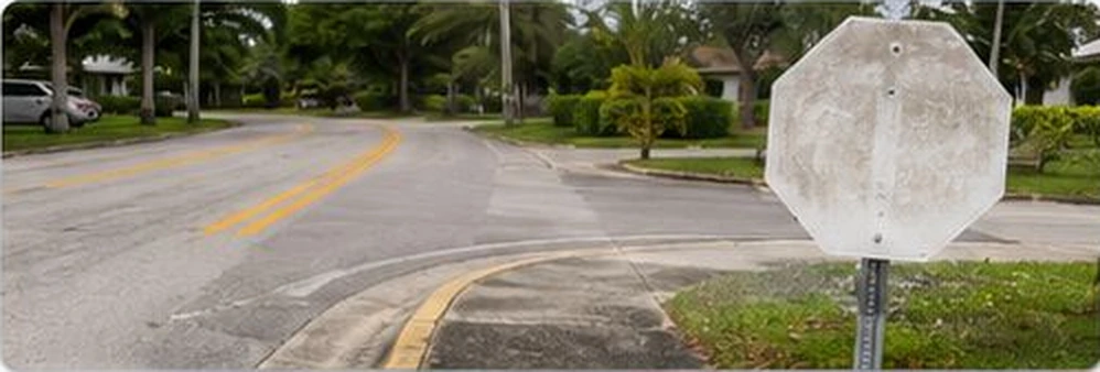 Faded stop sign at a North Miami neighborhood intersection